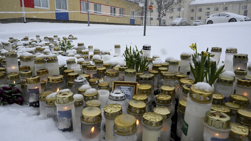 Mourners gather at Finnish school after child killed in shooting