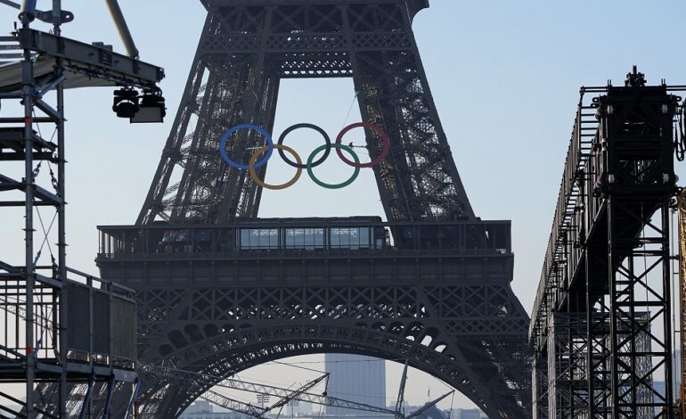 Paris Olympics organisers unveil Olympic rings on Eiffel Tower